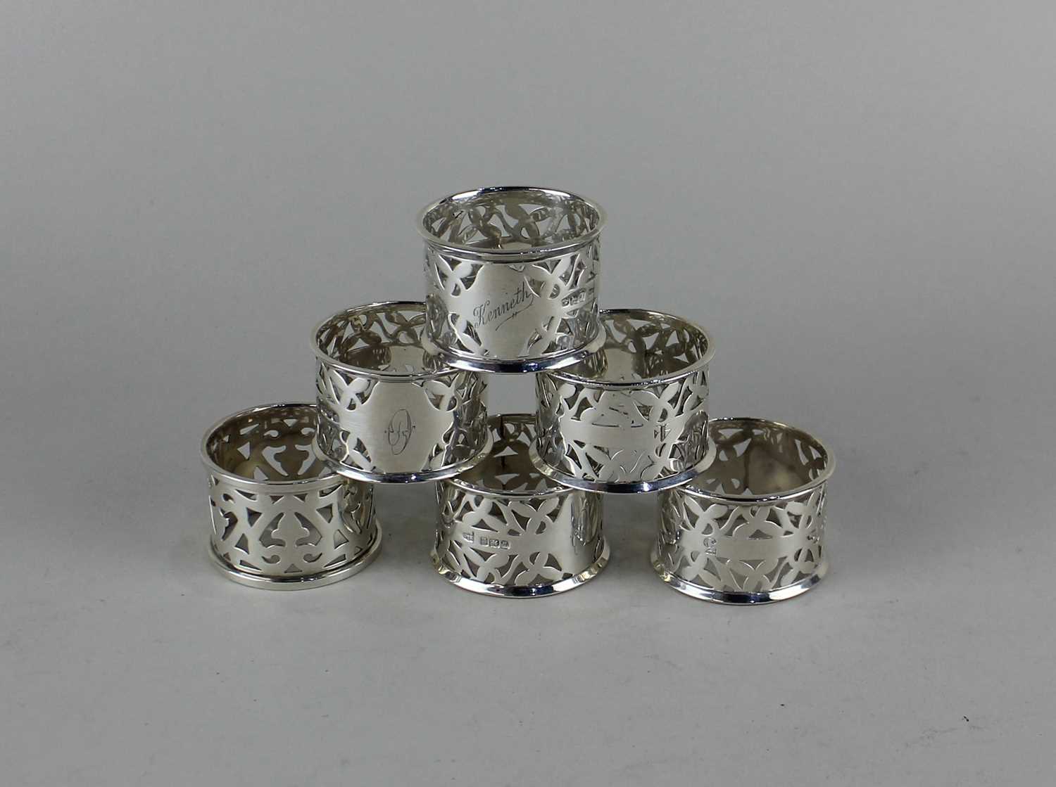 A set of five Edward VII silver serviette rings maker Walker and Hall, Sheffield1902 and another