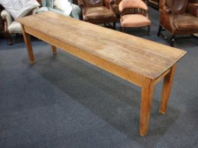 A rectangular pine 'beer' table with long three plank top, on square tapered legs, 233cm by 59cm