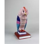 A large Herend handpainted porcelain model of an owl perched on a pile of books 31cm high