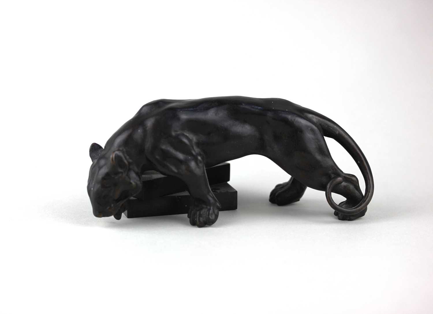An Art Deco bronze model of a panther 15cm long