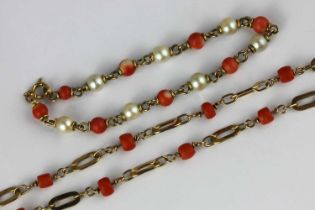 A 9ct gold and coral necklace in an oval link design and a cultured pearl and coral bracelet with