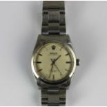 A Rolex Oyster Perpetual steel gentleman’s bracelet wristwatch the signed silvered dial with baton