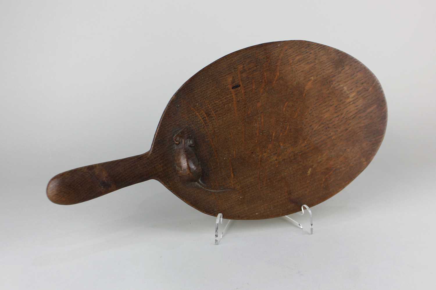A Robert Thompson 'Mouseman' oak cheese board carved with mouse signature 37cm long