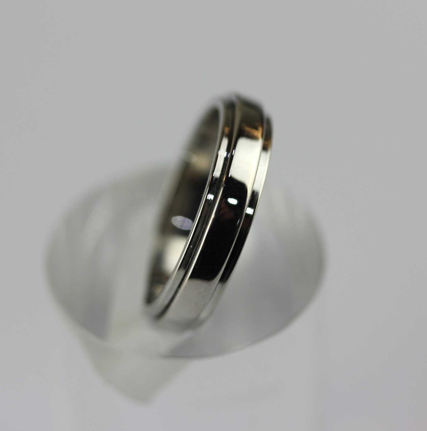 A Piaget 18ct white gold 'Possession' wedding band ring, detailed '750 D50476 57', ring size P, 6.