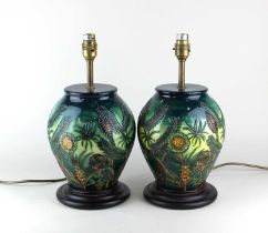 A pair of Moorcroft pottery 'Amazon Twilight' pattern table lamps, baluster form 36cm high including