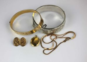 A gilt metal oval hinged bangle, a silver oval hinged bangle, Birmingham 1938, a 9ct gold cufflink
