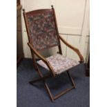 A late 19th / early 20th century folding steamer chair, jointed beech frame with upholstered back