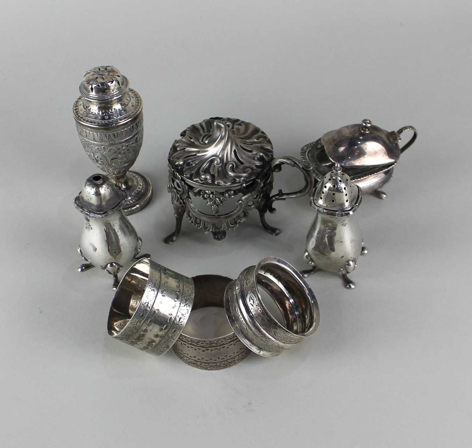 A Victorian silver pepper pot of neo classical design, another Victorian silver mustard cruet (lacks