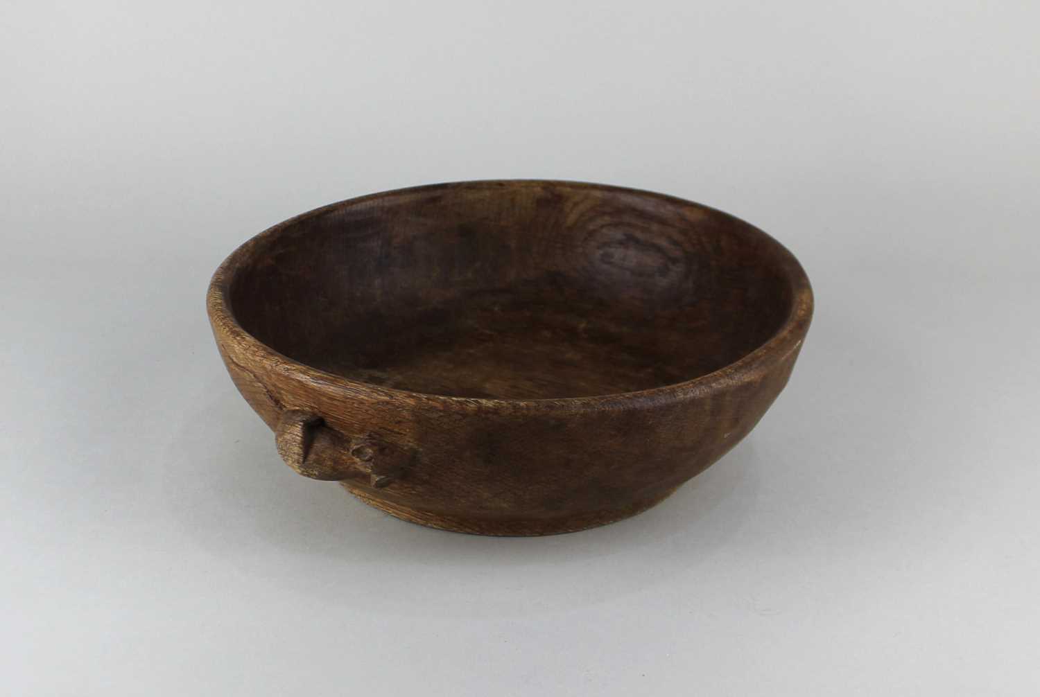 A Robert Thompson 'Mouseman' oak circular bowl, carved with mouse signature 24cm diameter