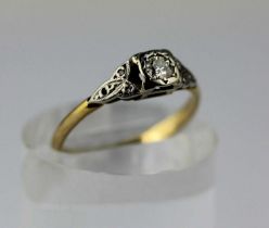 A gold and diamond ring mounted with the principal circular cut diamond at the centre between