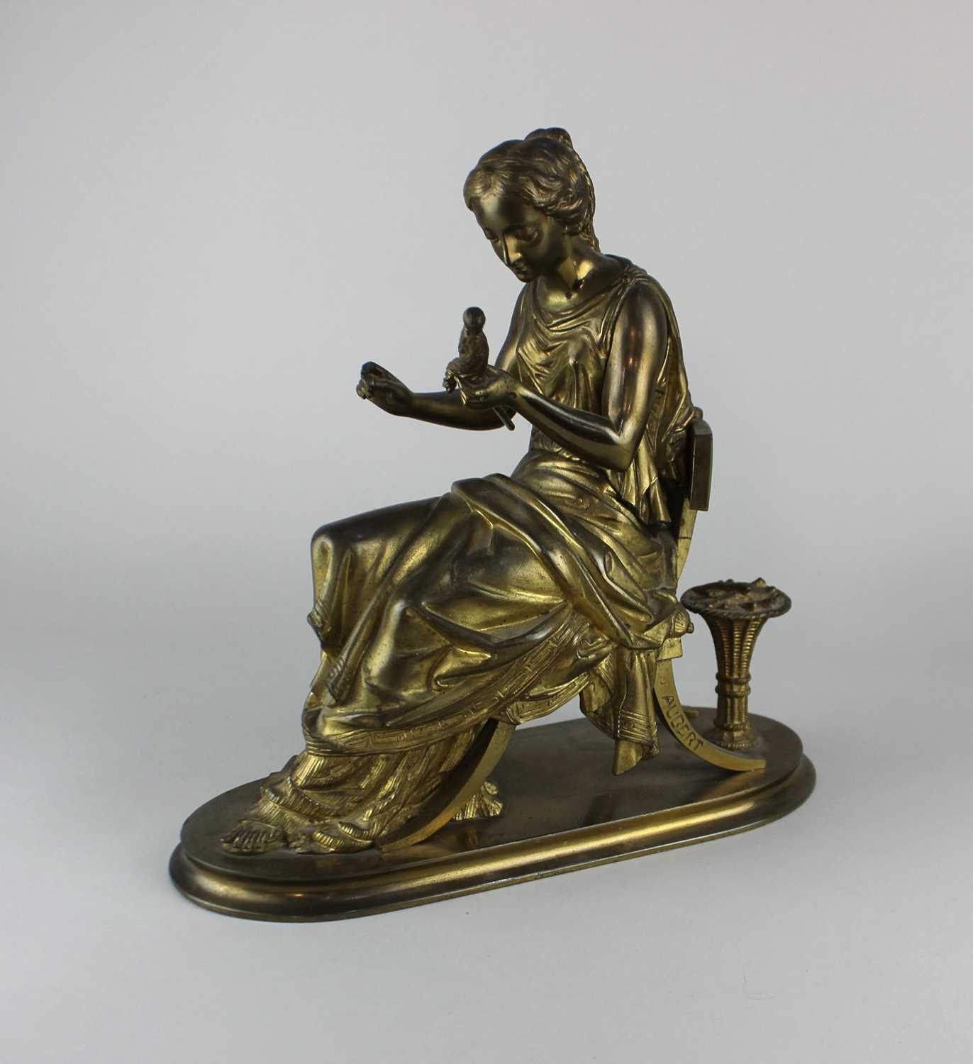 After Antoine-Pierre Aubert (1853 -1912), a gilt metal figure of a woman mending a fishing net