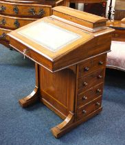 A Victorian mahogany Davenport desk with stationary box above a leather writing slope, above four