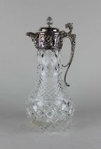 A Victorian style silver mounted glass claret jug with pine cone finial, mask head spout and