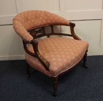 A Victorian rosewood inlaid tub chair with cream and red button upholstered back rail and set on