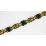 A gold and dyed green agate bracelet, designed as a row of rectangular links pierced with