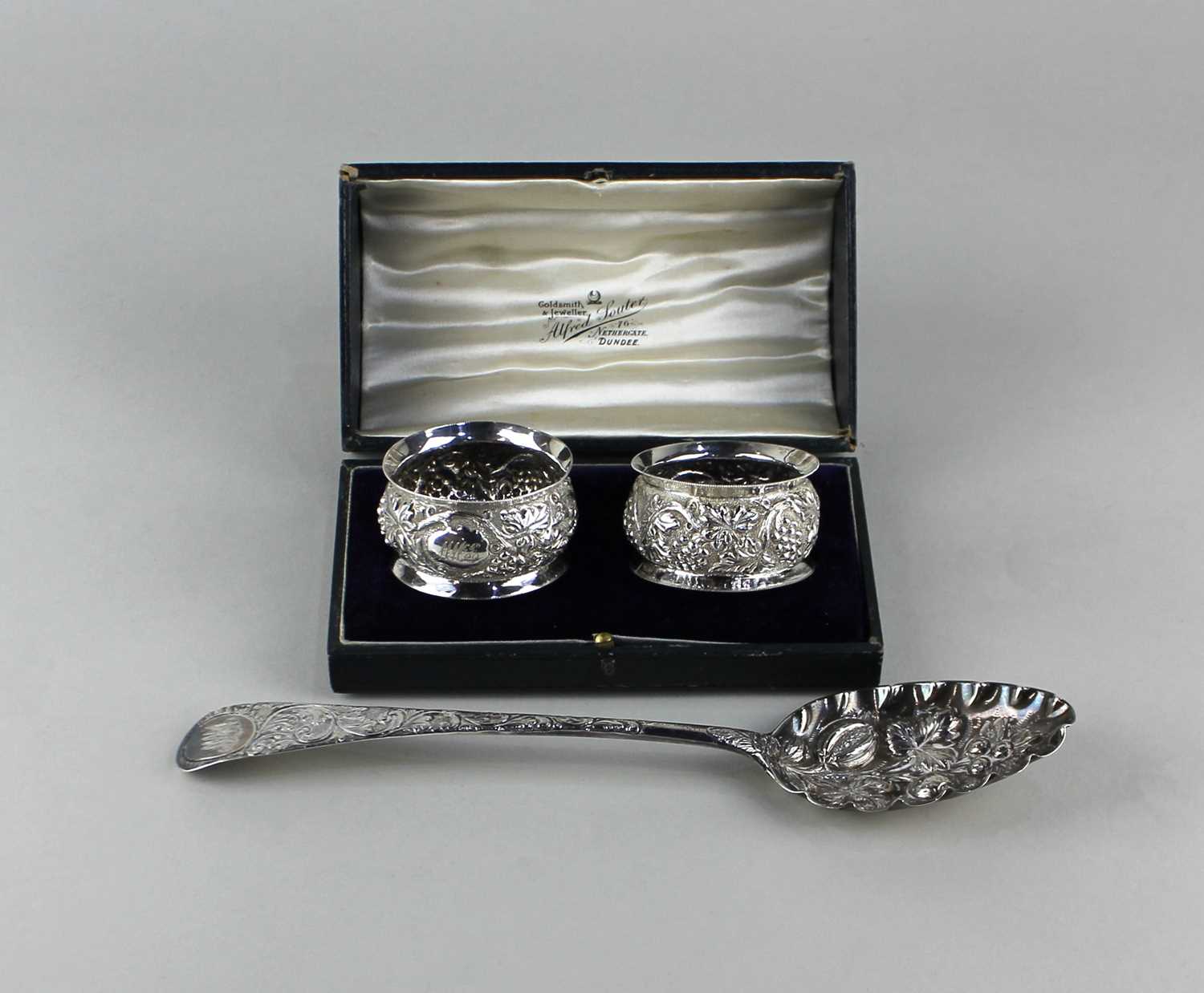 A George III silver berry spoon with later pressed decoration, London 1799, 22cm and a cased pair of