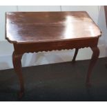 A George III oak side table with frieze drawer and wavy apron, on cabriole legs 74cm