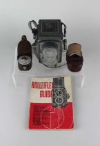 A Rolleiflex camera with extra lens, Rolleiflex guide and Capital Japan light meter