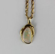 An 18ct gold and opal pendant on a gold neckchain gross weight 8.4g