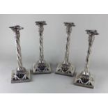 four silver plated spiral column candlesticks with removable sconces, spiral reeded columns, on