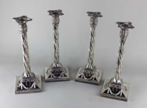four silver plated spiral column candlesticks with removable sconces, spiral reeded columns, on