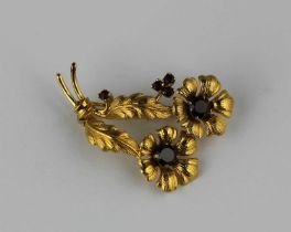 A 9ct gold and garnet brooch designed as a floral spray, London 1964, gross weight 5.7g