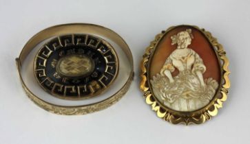 A Victorian gilt metal mounted oval shell cameo brooch carved as a girl with a basket, a Victorian