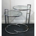 A pair of Modernist style chrome and glass side tables after Eileen Gray, E1027 model, circular form