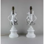 A pair of vintage Italian ceramic table lamps, modelled with cherubs, 20th century, 46cm high to top