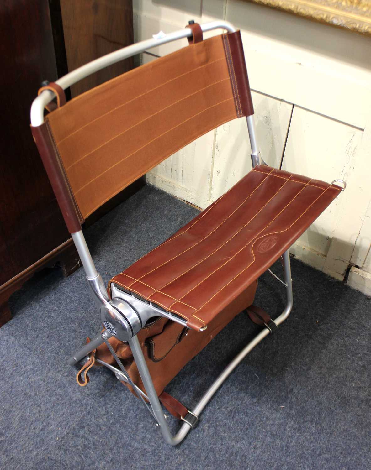 Bantam Manufacturing Co Ltd., a leather and aluminium 'The Bantam Chair' Folding Seat fitted with