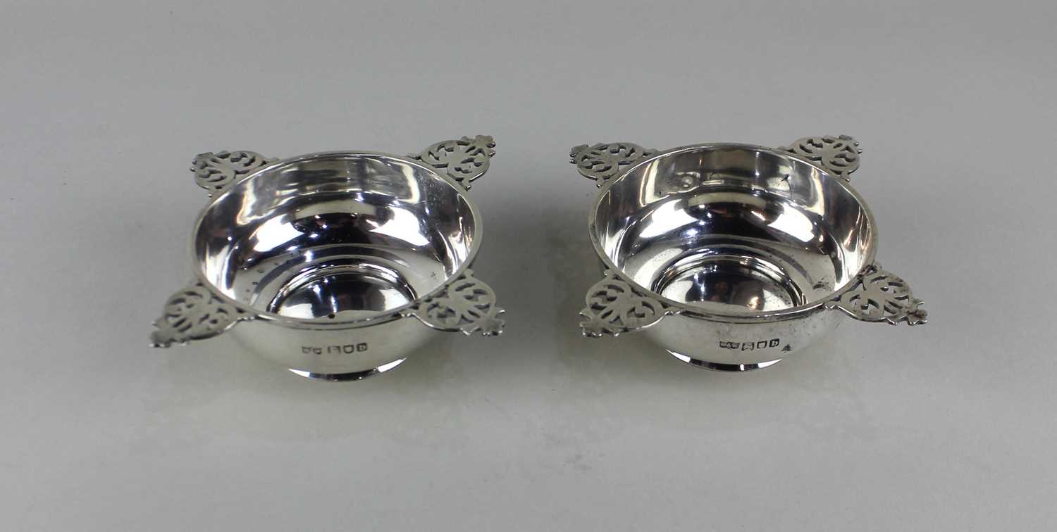 A pair of Victorian silver circular cruets with four pierced handles, maker Mappin & Webb, London