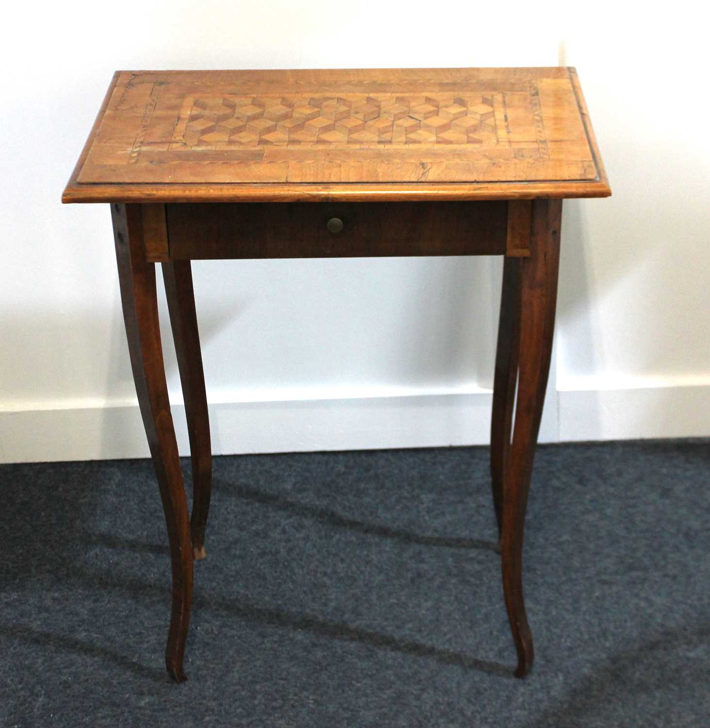 A walnut inlaid parquetry rectangular side table with block pattern centre panel above single drawer
