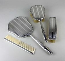 A vintage silver plated four piece dressing table set in original lined box, comprising a hand