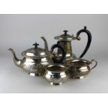 An Indian sterling silver four piece tea set, early 20th century, decorated throughout with embossed