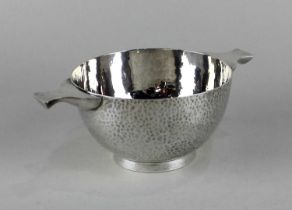 A George V silver quaiche bowl hammered decoration, engraved inscription to base, maker Searle & Co.