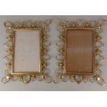 A pair of late 19th / early 20th century brass photo frames, being of rectangular form with openwork