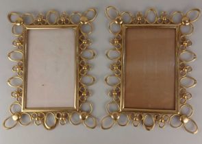 A pair of late 19th / early 20th century brass photo frames, being of rectangular form with openwork