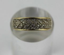 A 14ct gold and diamond ring mounted with circular cut diamonds, with pierced 'V' shaped decoration,