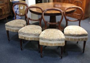 A set of four Victorian mahogany balloon back dining chairs, with foliate stamped upholstered seats,