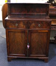 A Victorian mahogany chiffonier with raised shelf back, two drawers and cupboards, on bracket