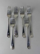A mixed six George III silver Old English pattern dinner forks with engraved initial, London 1795 (