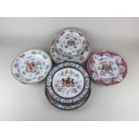 A collection of six armorial porcelain plates to include four Samson examples largest 25cm (a/f)