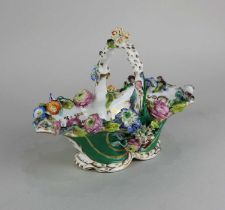 A 19th century Coalport porcelain floral encrusted sweetmeat basket 15cm high