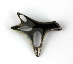 A Georg Jensen sterling silver and black enamelled brooch in an abstract design detailed 'HK 323',