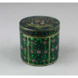 An Eastern enamelled 925 silver cylindrical pot and cover, decorated with a Peacock and stylised