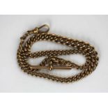 A 9ct gold graduated solid curb link gentleman's watch Albert chain fitted with a 9ct gold T bar and