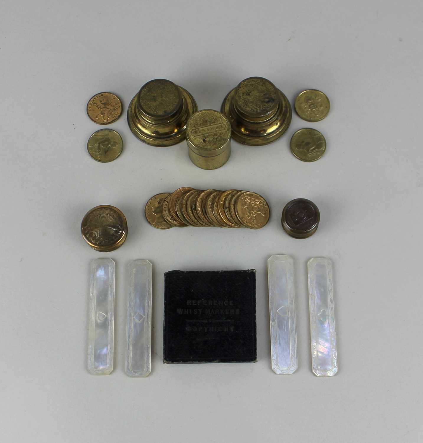 A collection of gaming counters, tokens and whist markers with five metal cases, to include The
