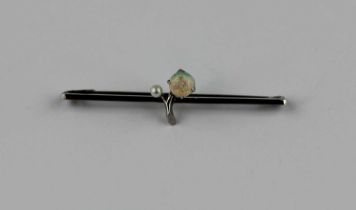 A white gold opal and seed pearl bar brooch with a central spray motif detailed '9ct' gross weight