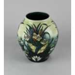 A Moorcroft pottery 'Lamia' pattern vase 22cm high