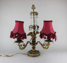 An Empire style two light table lamp converted from a candelabra, the central stem suspending